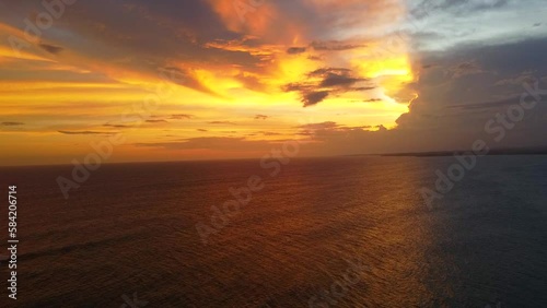 Aerial view from above of the sunset of the sea sandy shore. Ocean coast. Calm beautiful video on the background for tourism, design and advertising