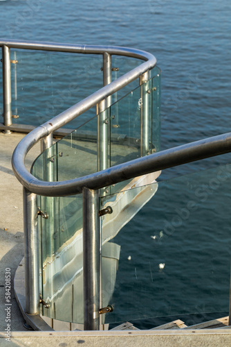 Glass and steel fence of the bridge.