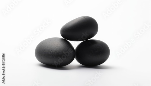 isolated black zen stones stacked on white background