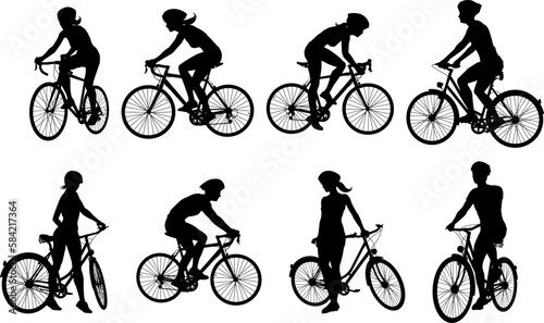 A set of bicyclists riding bikes and wearing a safety helmet in silhouette