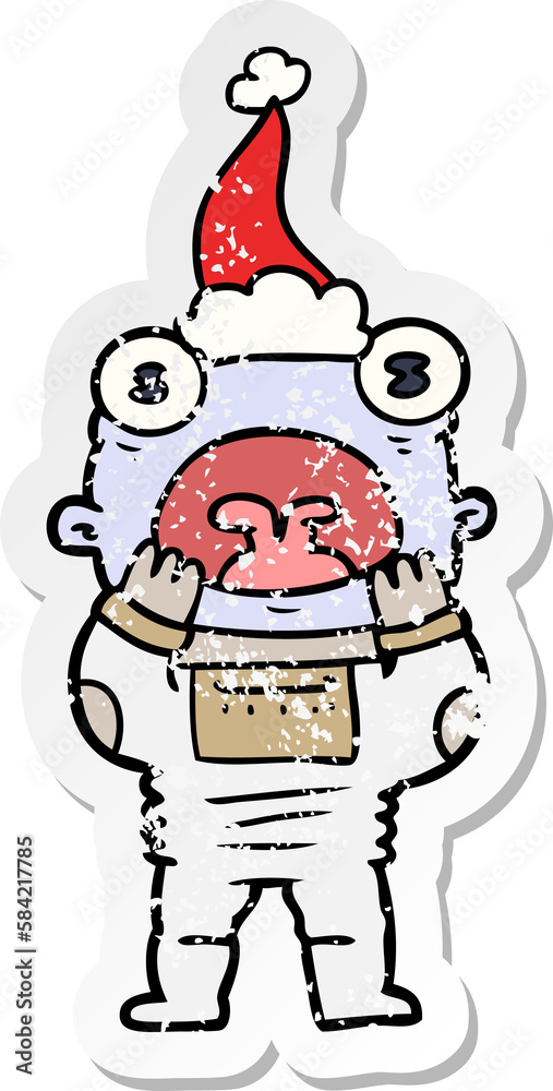 distressed sticker cartoon of a alien gasping in surprise wearing santa hat