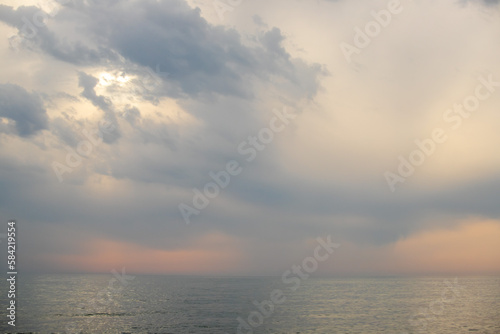 Sunset on the sea, sky with clouds, summer.