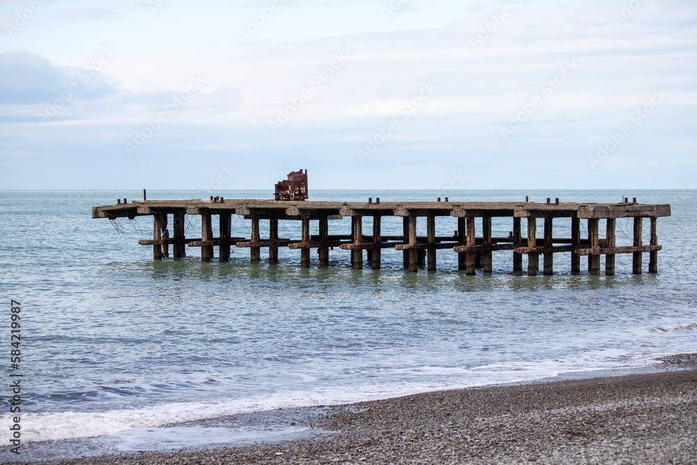 pier on the seashore, sea sky