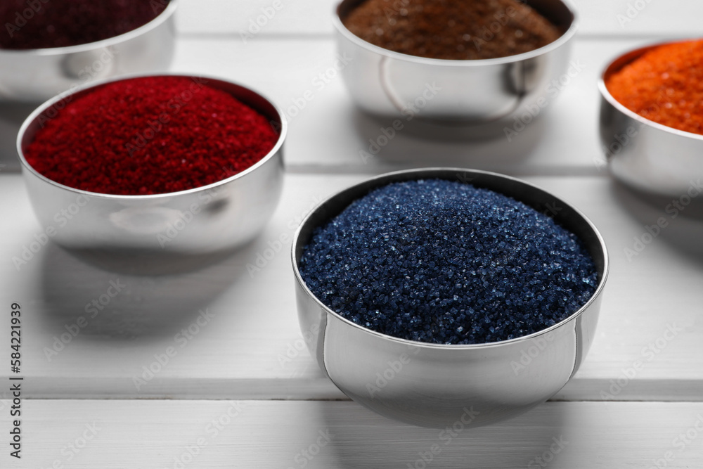Different food coloring on white wooden table, closeup Different food coloring on white wooden table, closeup
