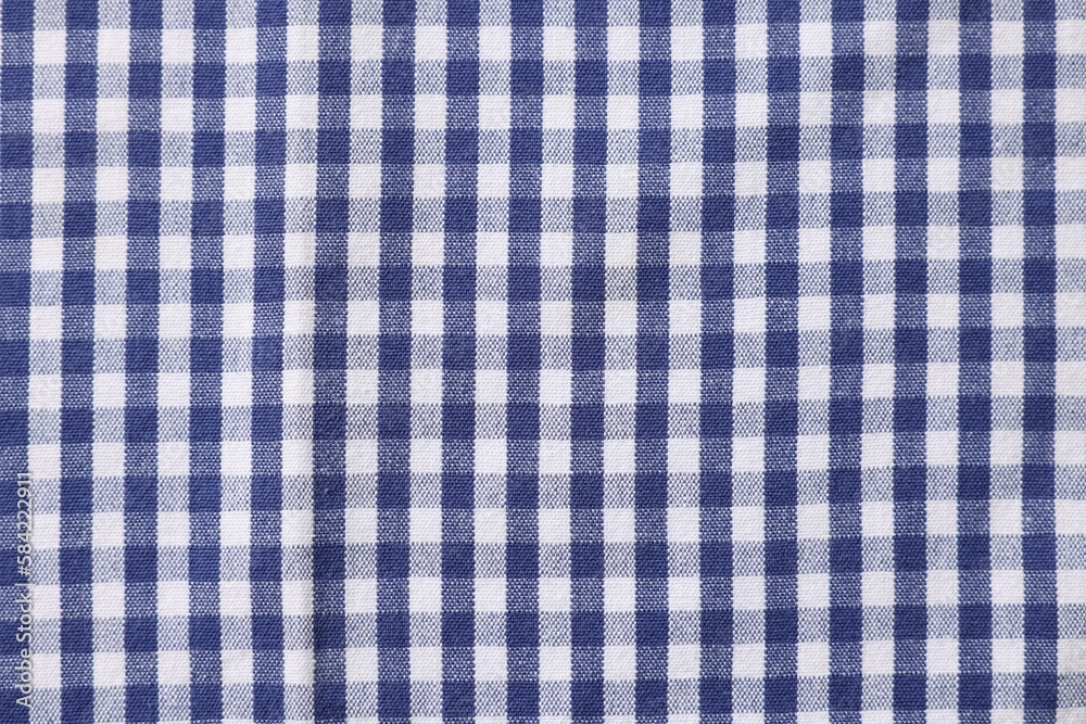 Blue checkered tablecloth as background, top view Blue checkered tablecloth as background, top view