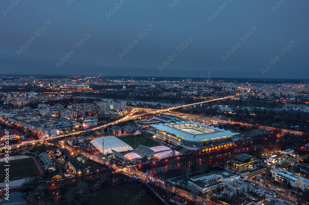 Obraz premium Aerial night skyline cityscape of the illuminated Warsaw, Poland