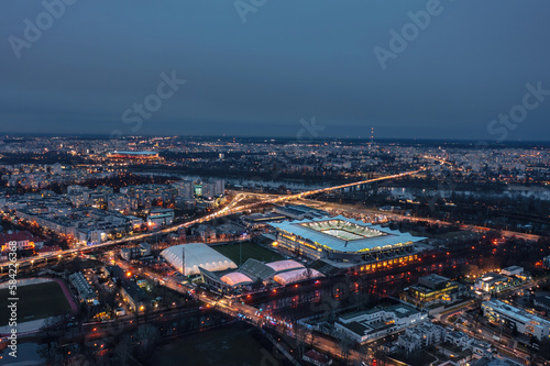 Aerial night skyline cityscape of the illuminated Warsaw, Poland
