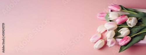 Pink and white tulips with gift box on pink pastel background