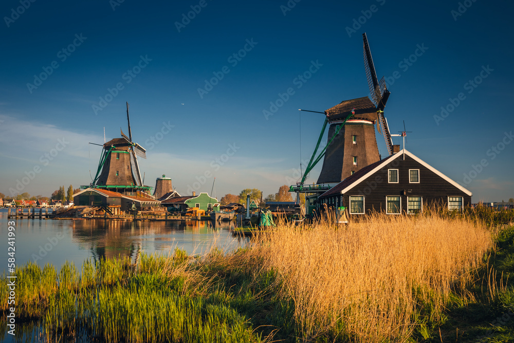 Morning at Zaanse Schans in the Netherlands - it is one of the most beautifully located open-air museums in Europe. Here we will find classic Dutch buildings.