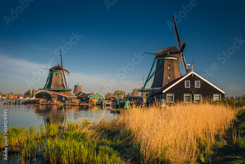 Morning at Zaanse Schans in the Netherlands - it is one of the most beautifully located open-air museums in Europe. Here we will find classic Dutch buildings. © PawelUchorczak