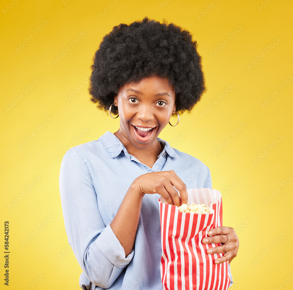Surprise, wow and popcorn with black woman in studio for movie, streaming service and cinema. Happy, comedy and theatre with female and snack isolated on yellow background for food, tv and film Surprise, wow and popcorn with black woman in studio for movie, streaming service and cinema. Happy, comedy and theatre with female and snack isolated on yellow background for food, tv and film