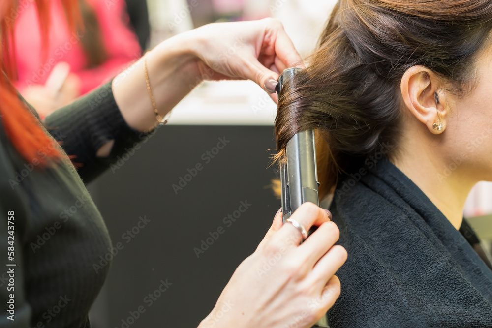Fototapeta premium The process of creating hairstyles, hair care. Background, selective focus.