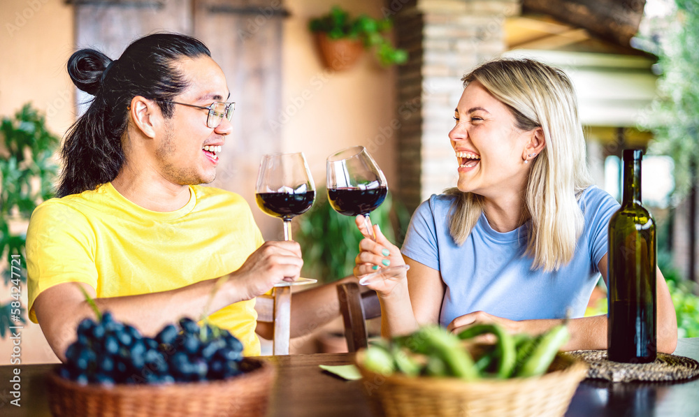 Happy couple in love toasting red wine at countryside farm house restaurant - Food and beverage life style concept with boyfriend and girlfriend having fun drinking together - Bright warm filter Happy couple in love toasting red wine at countryside farm house restaurant - Food and beverage life style concept with boyfriend and girlfriend having fun drinking together - Bright warm filter
