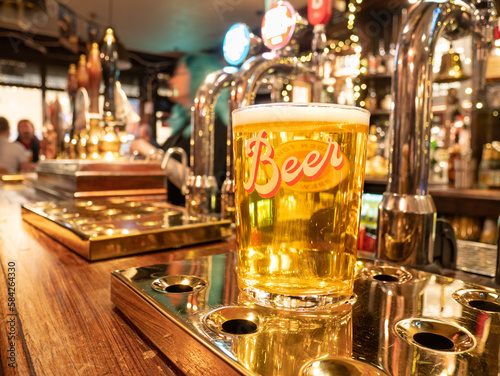 Photography Pint of lager on pub bar, London, UK