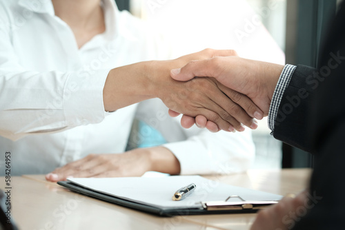 Lawyer handshake with client. Business partnership meeting successful concept.