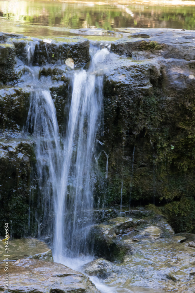 Obraz premium Natural waterfall over rocks