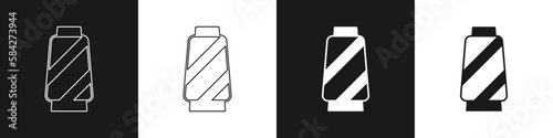 Set Sewing thread on spool icon isolated on black and white background. Yarn spool. Thread bobbin. Vector