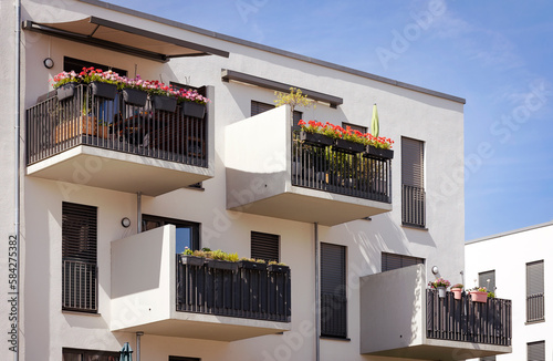 Tela Balcony with Decorated Flower pots of Modern Apartment Building in Europe, Germany