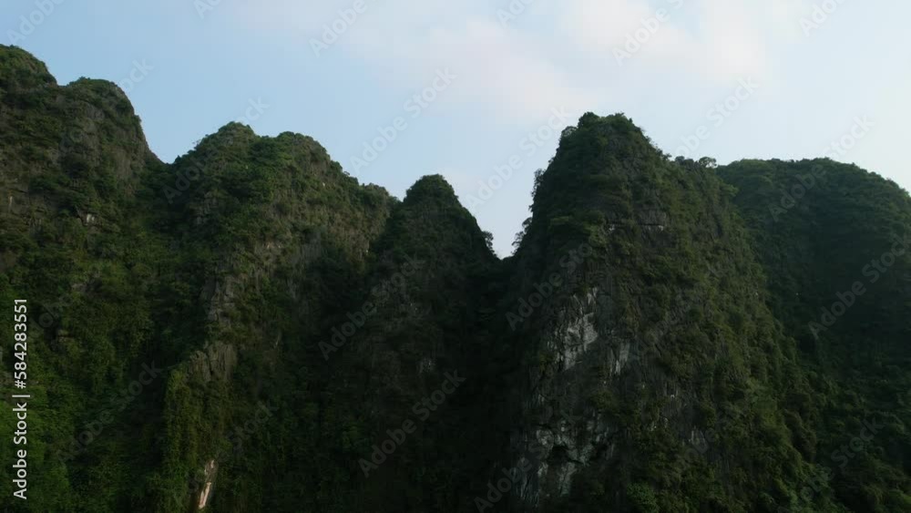 Towering Limestone Karsts or Ridges in Ninh Binh Vietnam at Sunset - Aerial Orbiting Towering Limestone Karsts or Ridges in Ninh Binh Vietnam at Sunset - Aerial Orbiting