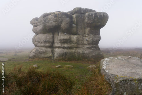 Cold, damp, foggy day at the Eagle Stone on Eagle Stone Flat in the Derbyshire. Peak District