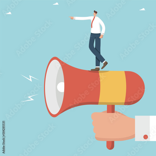 Communication leadership skills, conveying information or announcements, management communication with subordinates, leader in a team, man stands on loudspeaker and shows the direction of development.