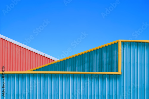 Two Colorful Corrugated Steel Warehouse Industrial Buildings against blue clear sky in Minimal style, Exterior Architecture Background Design concept
