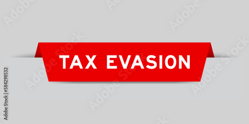 Red color inserted label with word tax evasion on gray background