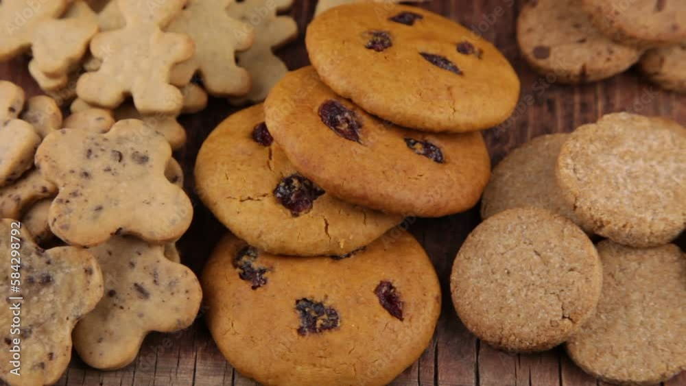 Set of different homemade cookies. Cookie close-up. Background from delicious pastries. Cookies with coconut, mishdal, chocolates, raisins, lingonberries. Round rhombuses, bears flowers shapes. Set of different homemade cookies. Cookie close-up. Background from delicious pastries. Cookies with coconut, mishdal, chocolates, raisins, lingonberries. Round rhombuses, bears flowers shapes.