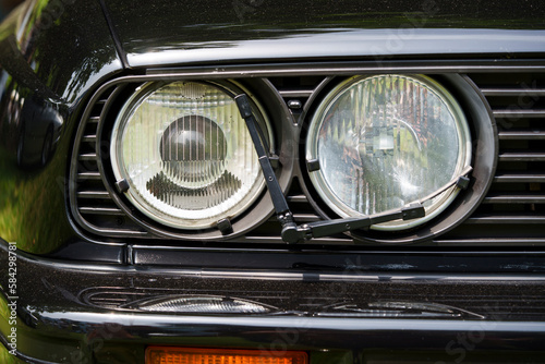 Two round headlights with a wiper © bizoo_n