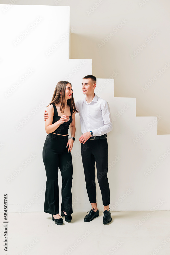 Fototapeta premium Young couple girl and boy in the studio modern lifestyle portrait. Love and relationship