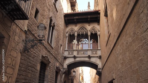 Pont del Bisbe and narrow street in Gothic Quarter in Barcelona. Spain. photo