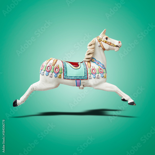 Floating classic carousel horse.on green gradient