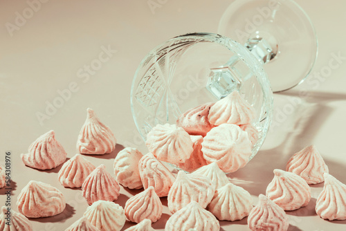 Pink meringue cookies in a crystal vase