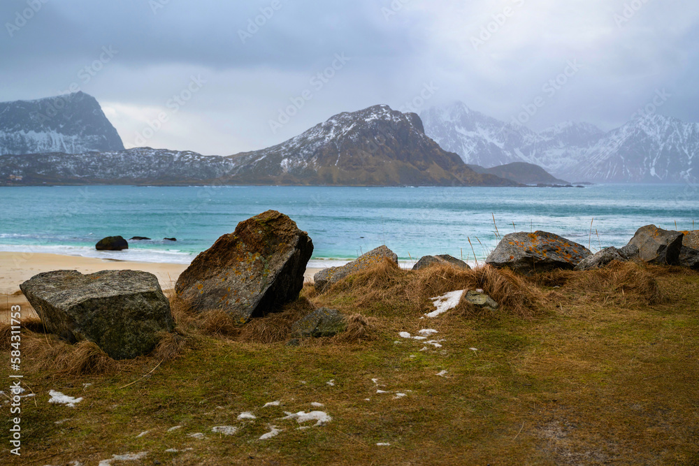 Stones on grass, beach Haukland, Lofoten.