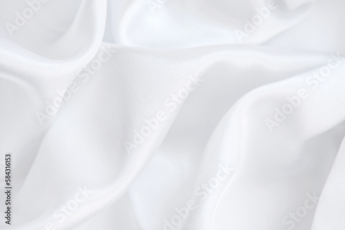 Background of white silky fabric with soft waves