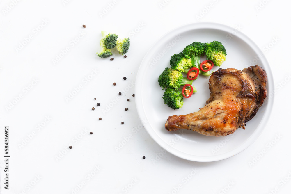 Healthy food grilled chicken has broccoli vegetable in plate on white wood table. Healthy food grilled chicken has broccoli vegetable in plate on white wood table.