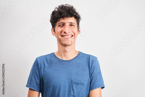 Portrait of a young man smiling with strabismus photo
