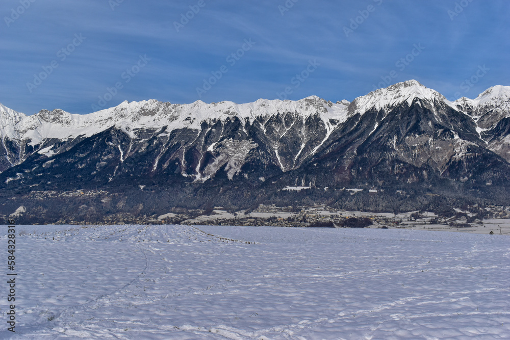 Panoramic view of beautiful winter wonderland mountain scenery in the Alps