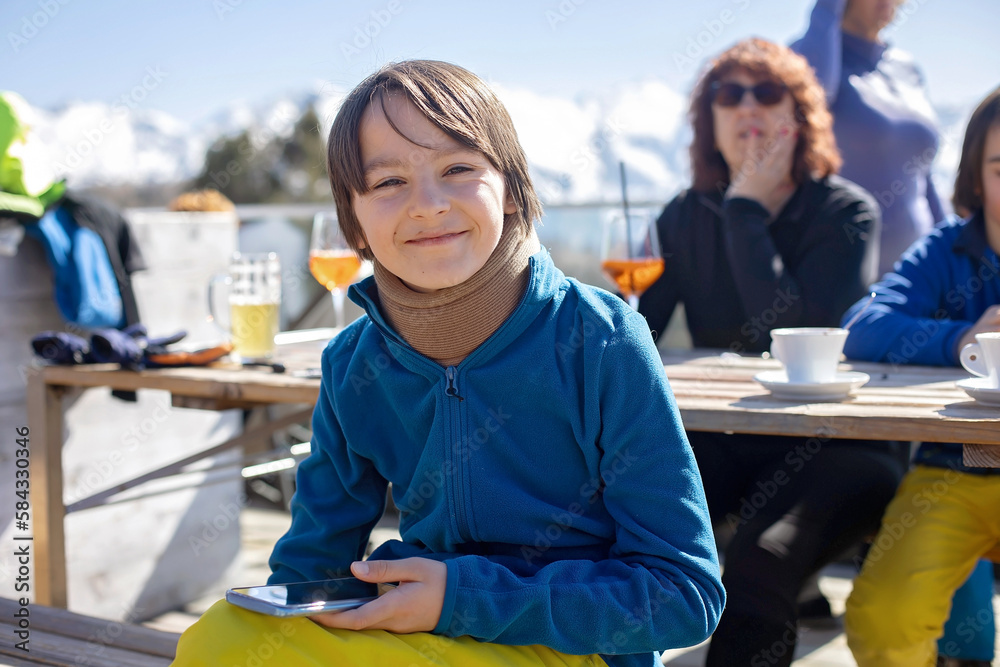 Happy family, enjoying ski holiday with children, sunny beautiful weather Happy family, enjoying ski holiday with children, sunny beautiful weather