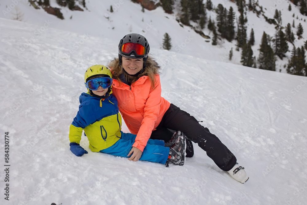 Happy family, enjoying ski holiday with children, sunny beautiful weather Happy family, enjoying ski holiday with children, sunny beautiful weather