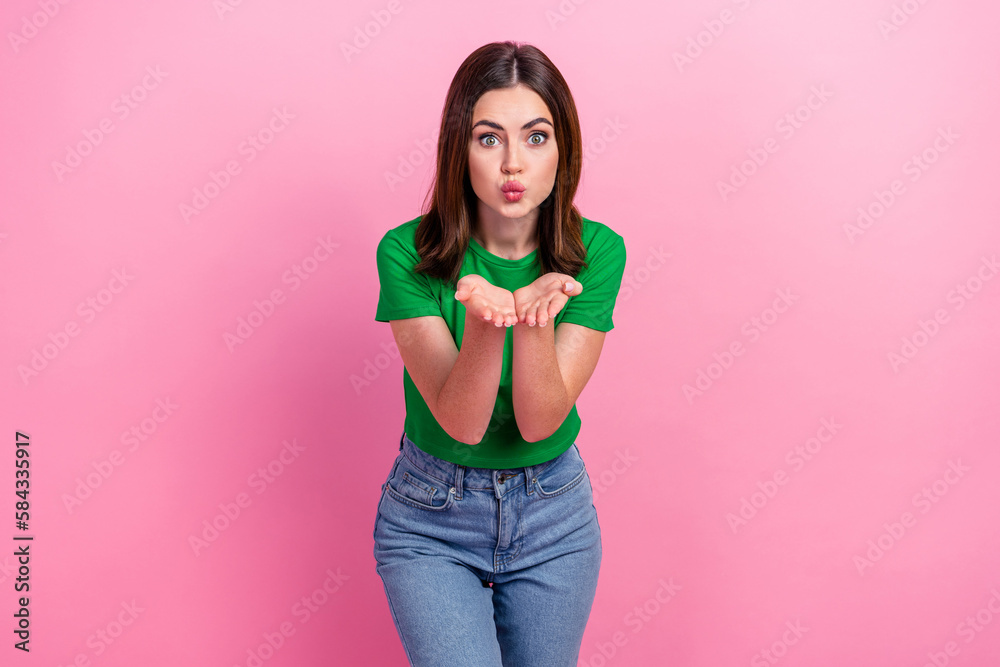 Photo of sweet nice girl arms palms pouted lips send air kiss camera you isolated on pink color background Photo of sweet nice girl arms palms pouted lips send air kiss camera you isolated on pink color background