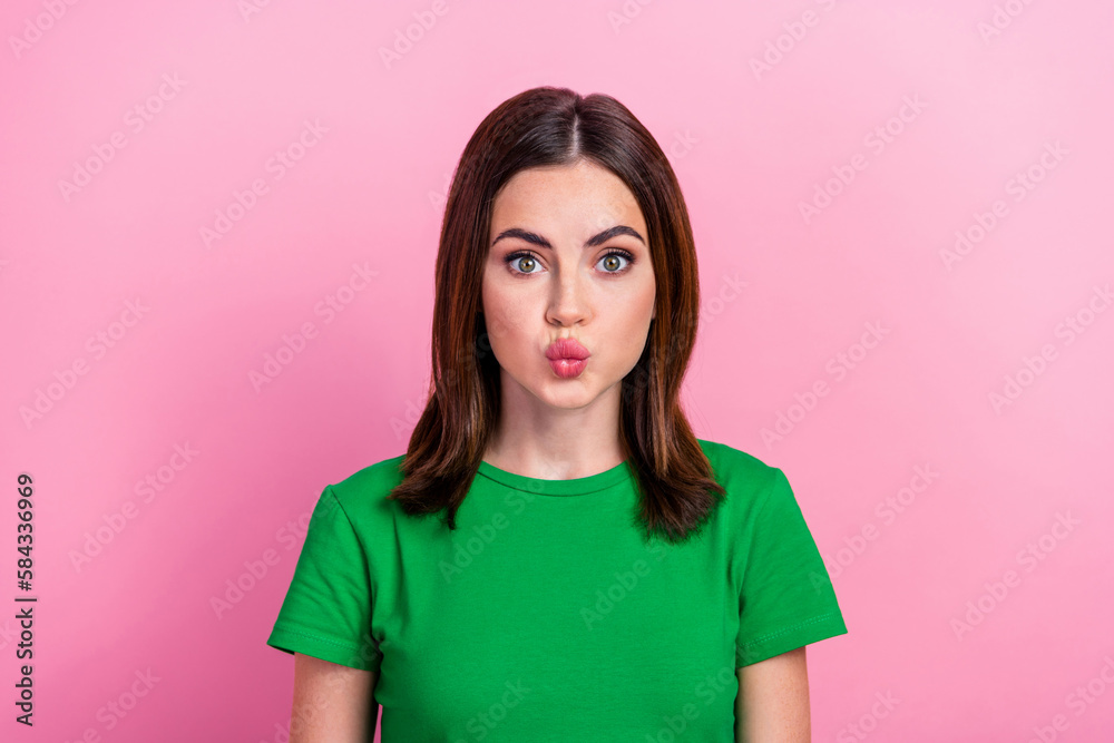 Photo of sweet shiny lady dressed green t-shirt sending you kiss lips pouted isolated pink color background Photo of sweet shiny lady dressed green t-shirt sending you kiss lips pouted isolated pink color background