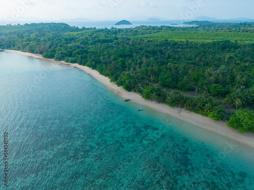 Aerial view tropical white sand beach wave green tree forest summer vacation background © themorningglory