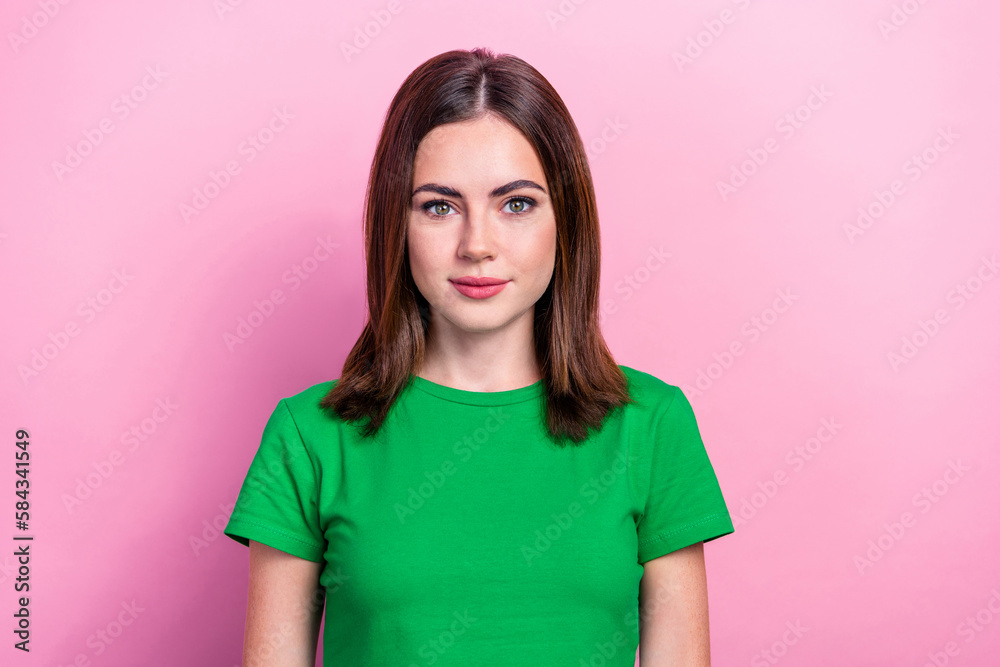 Fototapeta premium Photo of gorgeous friendly lovely girl with bob hairstyle dressed green t-shirt smiling at camera isolated on pink color background