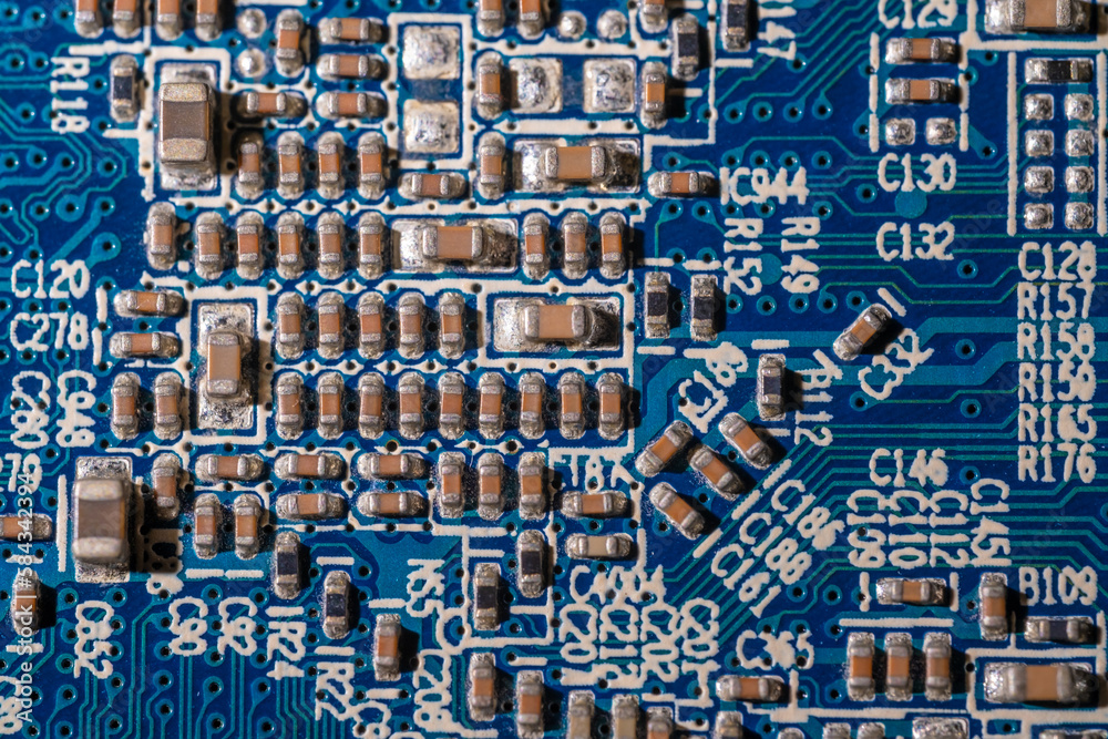 A microchip on a computer board in close-up.