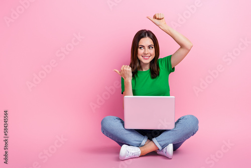 Full length photo of dreamy sweet girl wear green crop thumbs empty space typing modern device isolated pink color background