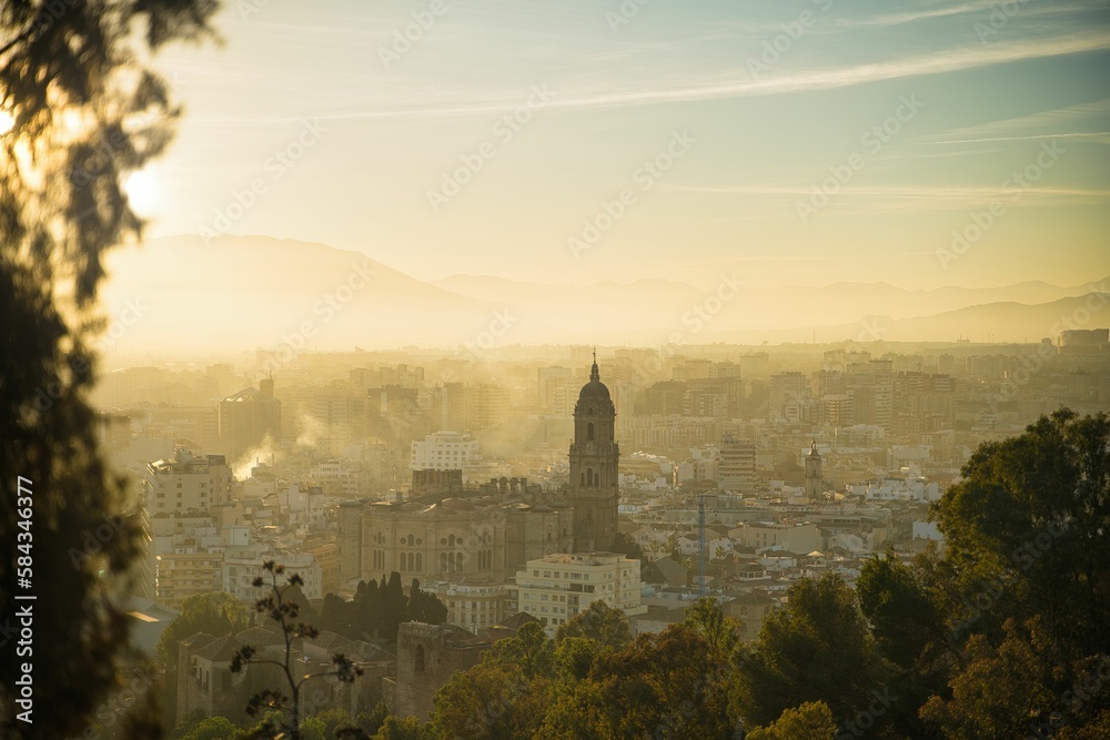 Scenic landscape view of Malaga city at sunset, Spain