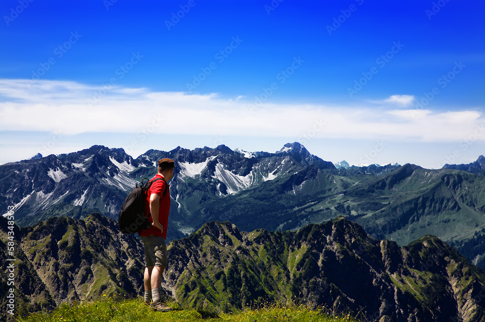 Hiker in the mountains, Allgäu Alps, Oberstdorf, Bavaria, Germany. Hiker in the mountains, Allgäu Alps, Oberstdorf, Bavaria, Germany.