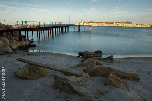 Fototapeta Naklejka Na Ścianę i Meble -  wooden pier on the beach