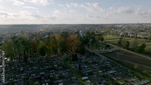 Aerial shot of a cemetery partially surrounded with trees in Salcininkai, Lithuania photo